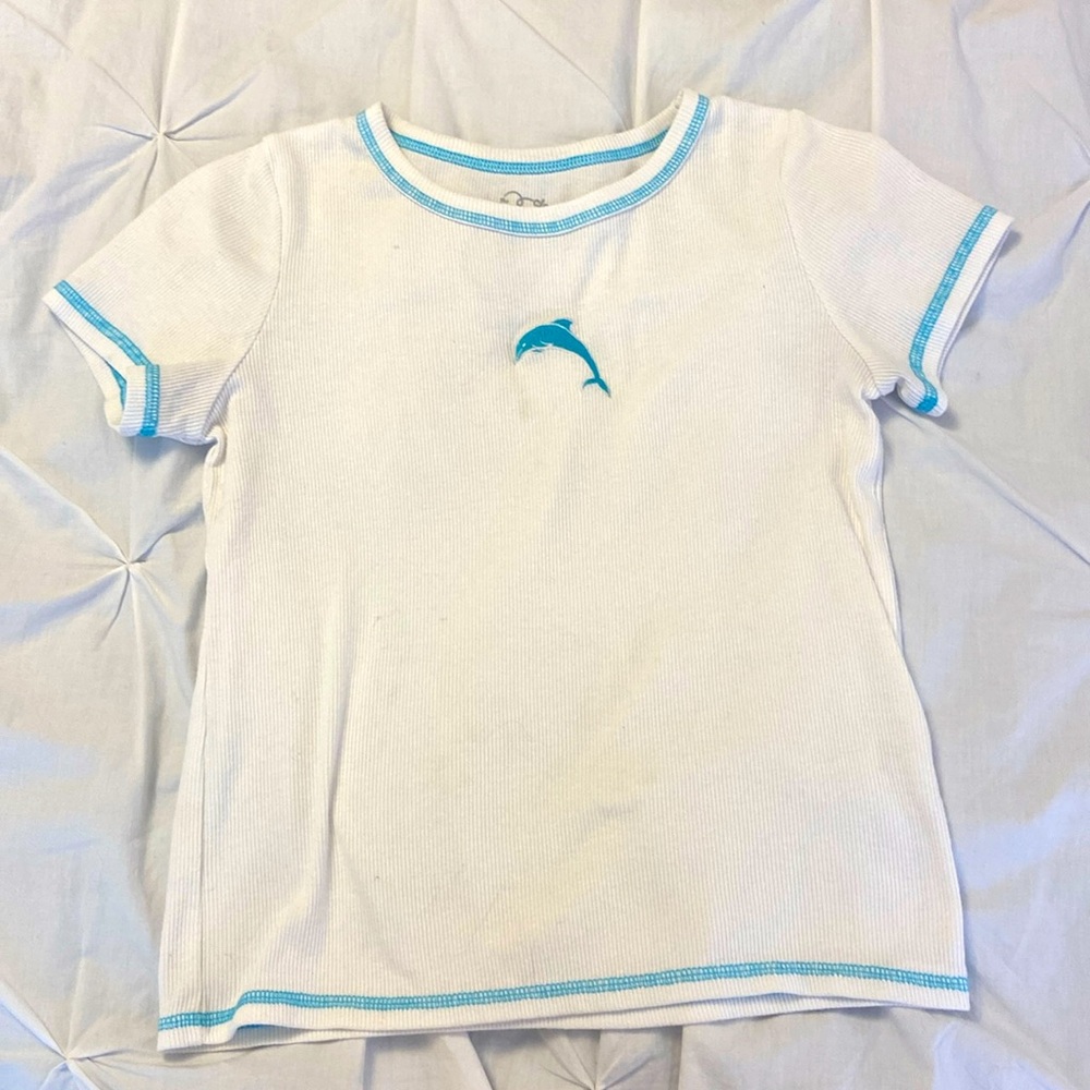 white shirt with dolphin